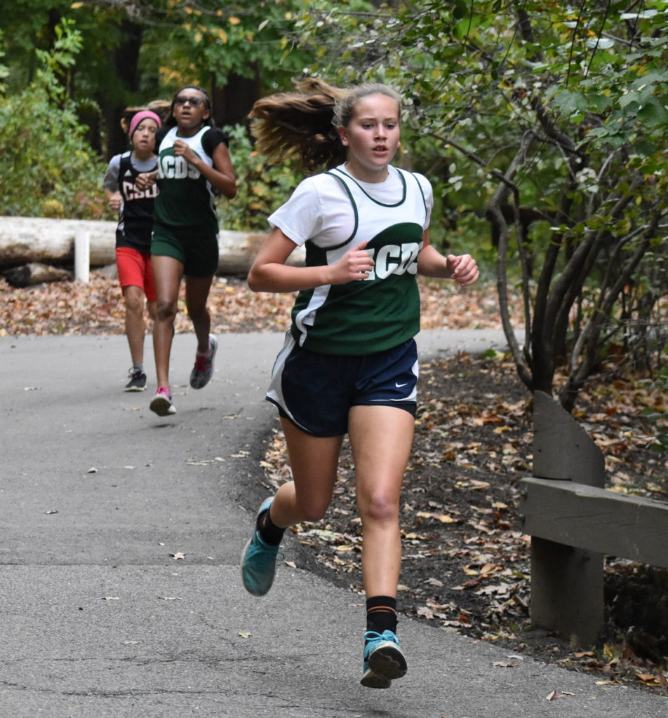ACDS three female students running in cross country championship