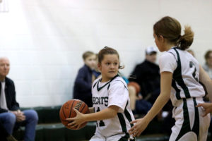 ACDS athletics two female team members with basketball during game