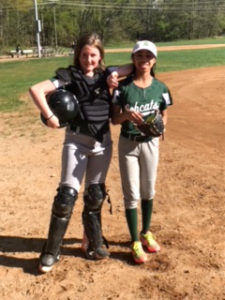 ACDS athletics two female students on softball team catcher and player with mitt