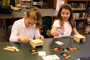 ACDS lower school two girls working with blocks in library