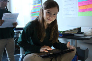 ACDS Middle School girl working with iPad