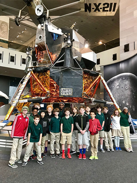 ACDS science group of students standing in front of model of lunar landing pod